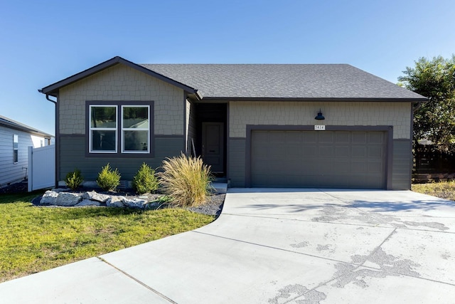 5414 E Bridgeport Ct, Spokane, WA 99217 - view of front of property with an attached garage, concrete driveway, a front yard, and a shingled roof