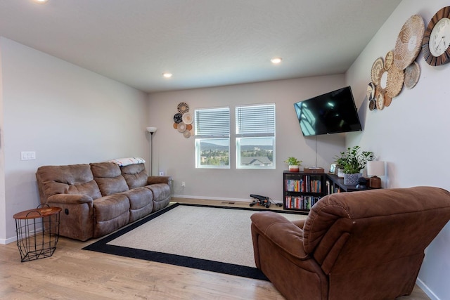 5414 E Bridgeport Ct, Spokane, WA 99217 - living area featuring wood finished floors and recessed lighting