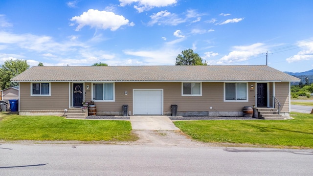 4806 N Drury Rd, Otis Orchards, WA 99027 - ranch-style house with an attached garage, concrete driveway, a front yard, and entry steps