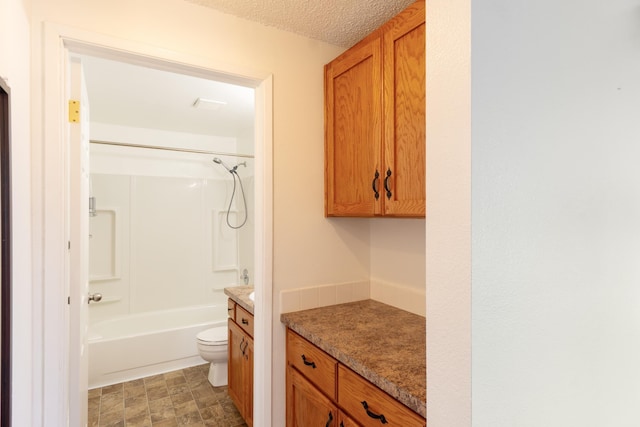 4806 N Drury Rd, Otis Orchards, WA 99027 - full bath featuring vanity, bathing tub / shower combination, and a textured ceiling