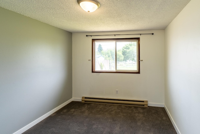 4806 N Drury Rd, Otis Orchards, WA 99027 - unfurnished room with a baseboard heating unit, dark carpet, and a textured ceiling
