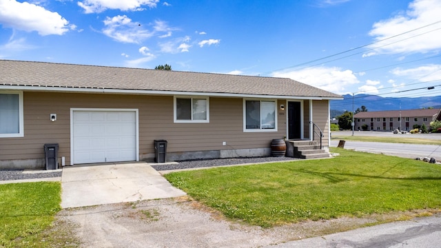 4806 N Drury Rd, Otis Orchards, WA 99027 - ranch-style house with a front lawn, driveway, and a shingled roof