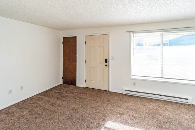 4806 N Drury Rd, Otis Orchards, WA 99027 - carpeted spare room with baseboard heating and a textured ceiling