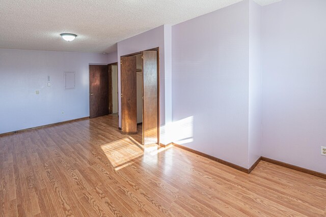 4806 N Drury Rd, Otis Orchards, WA 99027 - unfurnished room with wood finished floors and a textured ceiling