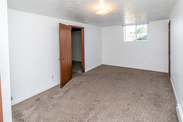 4806 N Drury Rd, Otis Orchards, WA 99027 - unfurnished bedroom with carpet and a baseboard heating unit