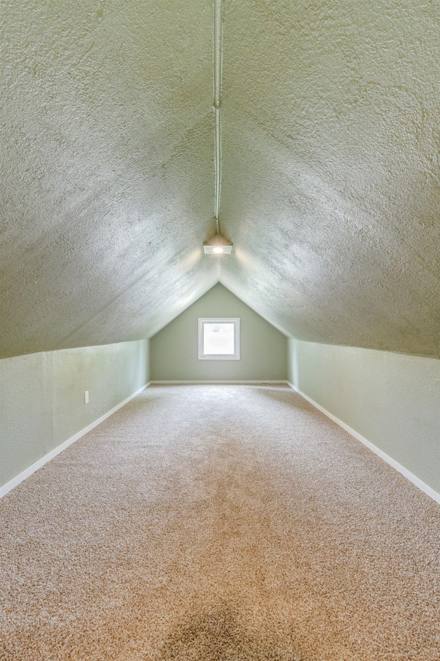 109 E 6th St, Deer Park, WA 99009 - additional living space with a textured ceiling, carpet flooring, and lofted ceiling