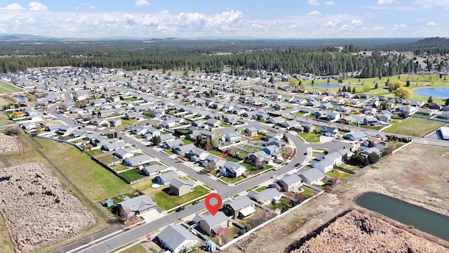 6922 S Lucas St, Cheney, WA 99004 - aerial view of property and surrounding area featuring a nearby body of water, nearby suburban area, and a forest