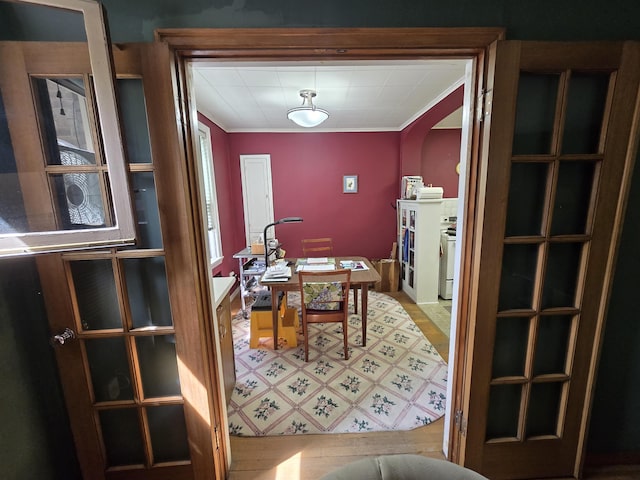 726 W 6th Ave Unit # 205, Spokane, WA 99204 - dining space featuring ornamental molding and light wood-type flooring