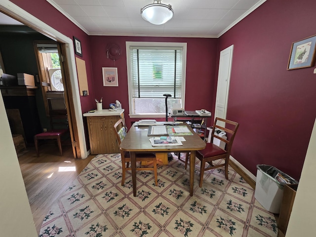726 W 6th Ave Unit # 205, Spokane, WA 99204 - dining area with crown molding and light wood-style flooring