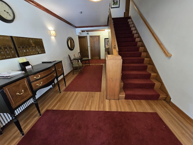 726 W 6th Ave Unit # 205, Spokane, WA 99204 - foyer with wood finished floors, stairway, and crown molding