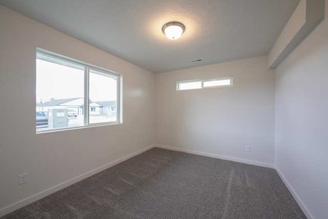 18424 E 1st Ln, Greenacres, WA 99016 - unfurnished room featuring dark carpet