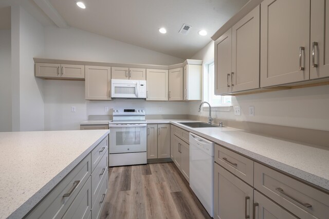18424 E 1st Ln, Greenacres, WA 99016 - kitchen with white appliances, lofted ceiling, light wood-type flooring, light countertops, and recessed lighting