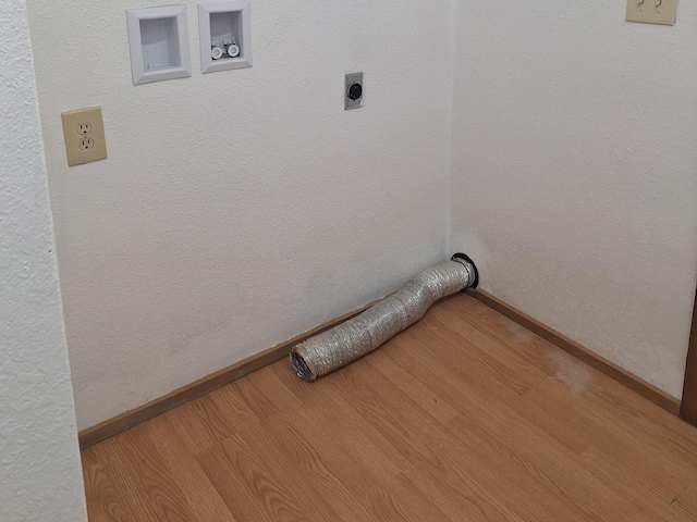 427 W 7th St, Newport, WA 99156 - laundry room with hookup for an electric dryer, wood finished floors, and washer hookup