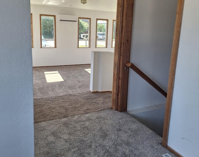 427 W 7th St, Newport, WA 99156 - hallway with carpet, an upstairs landing, and a wall mounted air conditioner