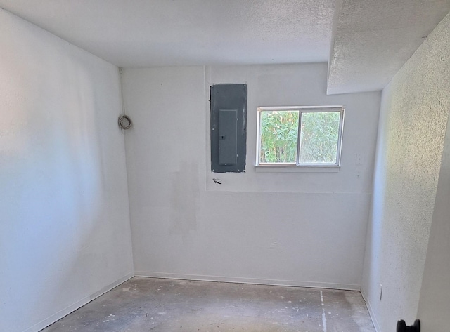 427 W 7th St, Newport, WA 99156 - unfurnished room featuring electric panel, concrete floors, and a textured ceiling