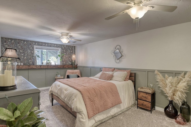 1407 S Shamrock St, Veradale, WA 99037 - bedroom with light carpet, wainscoting, a decorative wall, and ceiling fan