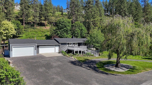 1407 S Shamrock St, Veradale, WA 99037 - view of front of house with an attached garage, driveway, stairs, and stucco siding