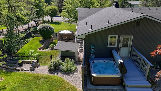 1407 S Shamrock St, Veradale, WA 99037 - rear view of house featuring roof with shingles, a hot tub, a fenced backyard, and a gate