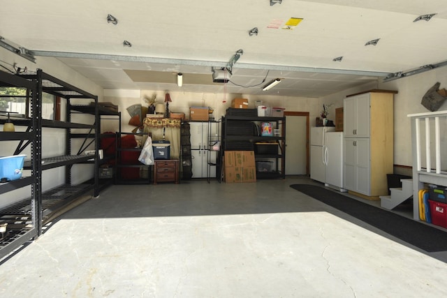 1407 S Shamrock St, Veradale, WA 99037 - garage with a garage door opener and freestanding refrigerator