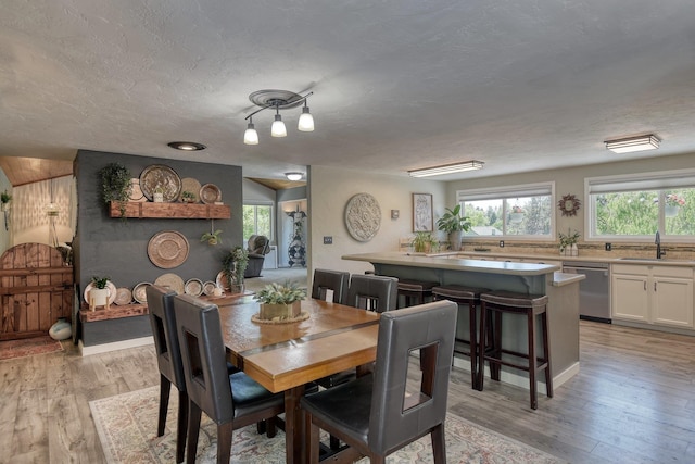 1407 S Shamrock St, Veradale, WA 99037 - dining area with light wood-style flooring and a textured ceiling