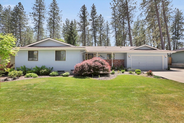 5311 W Shawnee Ave, Spokane, WA 99208 - ranch-style house featuring a garage, crawl space, concrete driveway, and a front lawn