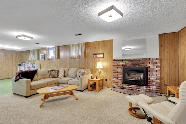 5311 W Shawnee Ave, Spokane, WA 99208 - living area featuring a textured ceiling, wooden walls, a brick fireplace, and carpet flooring