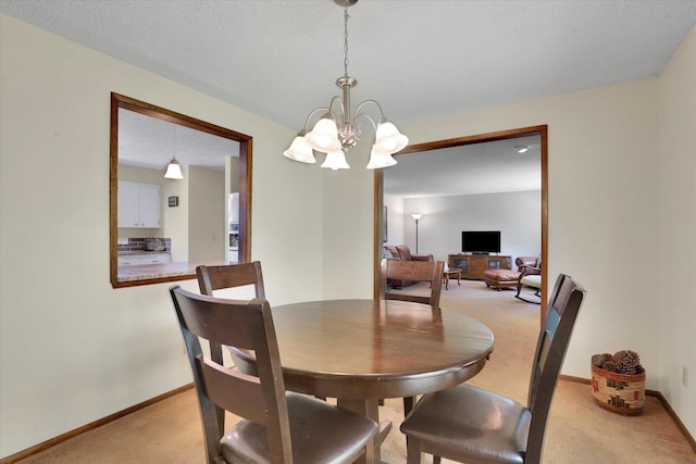 5311 W Shawnee Ave, Spokane, WA 99208 - dining space with light colored carpet and a chandelier