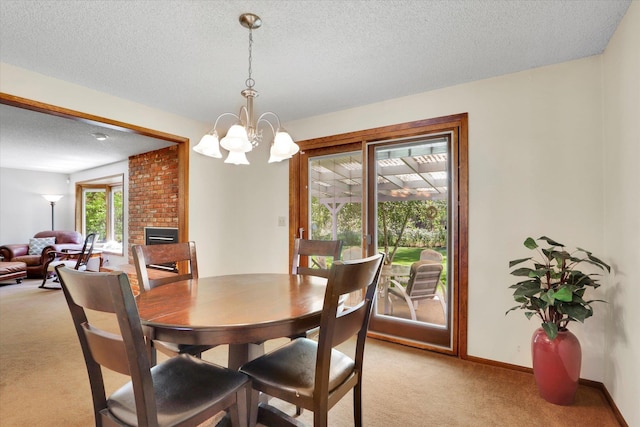 5311 W Shawnee Ave, Spokane, WA 99208 - dining room with light colored carpet, a textured ceiling, a chandelier, and a fireplace