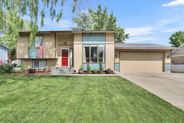 1508 N Arc St, Spokane Valley, WA 99016 - view of front facade featuring a garage, concrete driveway, a front yard, and entry steps
