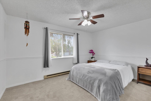 1508 N Arc St, Spokane Valley, WA 99016 - carpeted bedroom featuring baseboard heating, a textured ceiling, and a ceiling fan