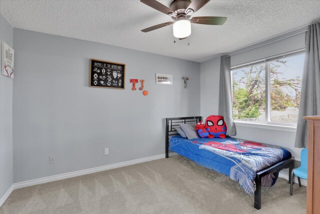 1508 N Arc St, Spokane Valley, WA 99016 - carpeted bedroom with a textured ceiling and a ceiling fan