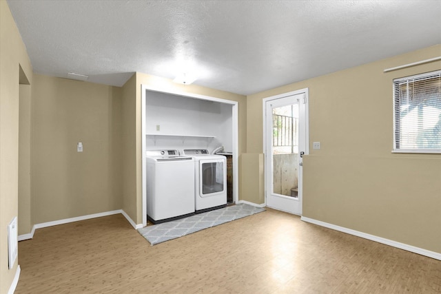 1508 N Arc St, Spokane Valley, WA 99016 - kitchen featuring washer and dryer, light wood-type flooring, and light countertops