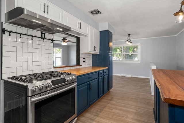 10413 E 6th Ave, Spokane Valley, WA 99206 - kitchen with wood counters, stainless steel gas range, blue cabinets, under cabinet range hood, and backsplash