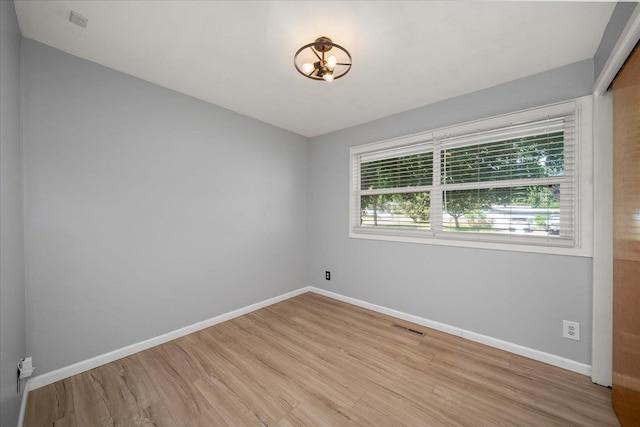 10413 E 6th Ave, Spokane Valley, WA 99206 - spare room with wood finished floors and baseboards