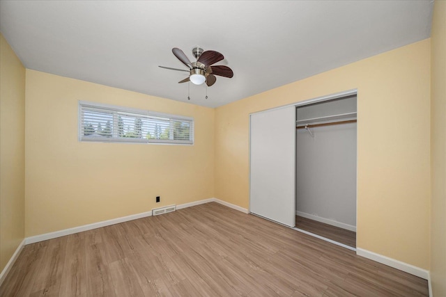 10413 E 6th Ave, Spokane Valley, WA 99206 - unfurnished bedroom featuring wood finished floors, a closet, and a ceiling fan