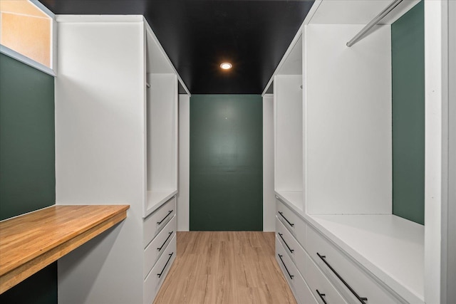 10413 E 6th Ave, Spokane Valley, WA 99206 - walk in closet with light wood-type flooring