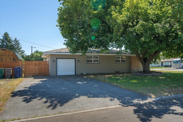 10413 E 6th Ave, Spokane Valley, WA 99206 - view of front of home featuring asphalt driveway, an attached garage, and a gate