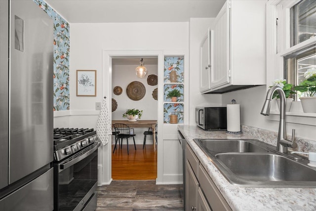 3328 W Kiernan Ave, Spokane, WA 99205 - kitchen featuring stainless steel appliances, dark wood-type flooring, white cabinetry, and light countertops