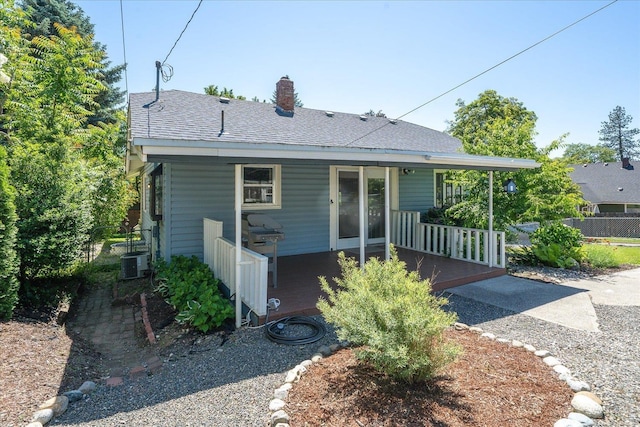 3328 W Kiernan Ave, Spokane, WA 99205 - view of front facade featuring a porch, a chimney, and roof with shingles