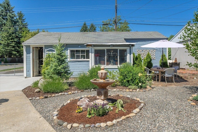 3328 W Kiernan Ave, Spokane, WA 99205 - view of front of home featuring a patio area and roof with shingles