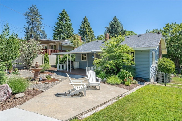3328 W Kiernan Ave, Spokane, WA 99205 - rear view of house with a patio area, a gate, roof with shingles, and a chimney
