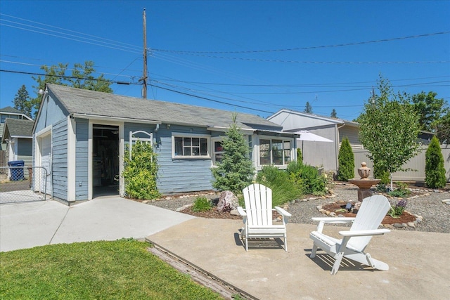 3328 W Kiernan Ave, Spokane, WA 99205 - view of front of house with a patio and a shingled roof