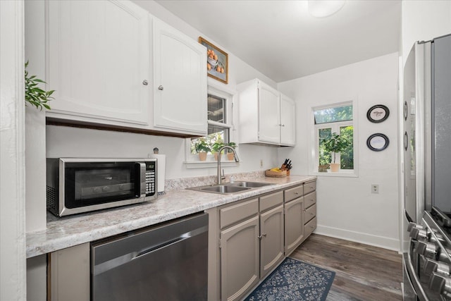 3328 W Kiernan Ave, Spokane, WA 99205 - kitchen with appliances with stainless steel finishes, light countertops, dark wood-style flooring, white cabinetry, and gray cabinets