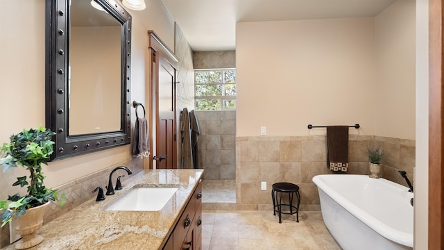 21617 E Harvard Vistas Ln, Newman Lake, WA 99025 - full bathroom featuring a freestanding tub, vanity, tile walls, and a walk in shower