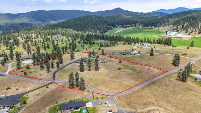 21617 E Harvard Vistas Ln, Newman Lake, WA 99025 - aerial view of property's location featuring a mountainous background and property parcel outlined