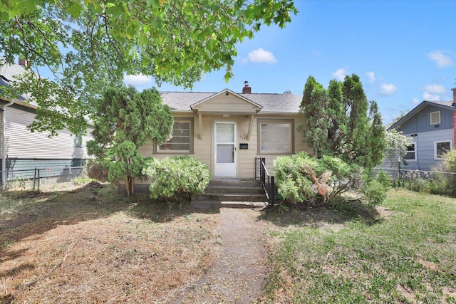 314 E Everett Ave, Spokane, WA 99207 - view of front of property featuring a chimney, entry steps, and roof with shingles