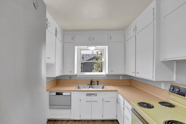 314 E Everett Ave, Spokane, WA 99207 - kitchen featuring white appliances, light countertops, and white cabinets