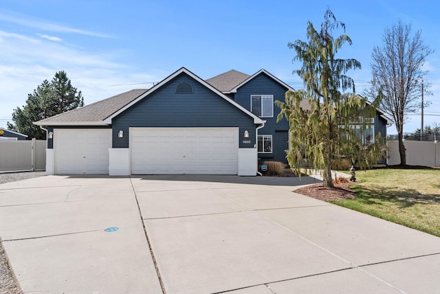 9805 N Jesse Ct, Spokane, WA 99208 - view of front of home with a garage, concrete driveway, and a shingled roof