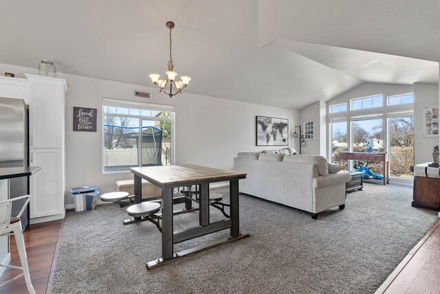 9805 N Jesse Ct, Spokane, WA 99208 - dining space featuring a chandelier, lofted ceiling, and dark wood-style floors