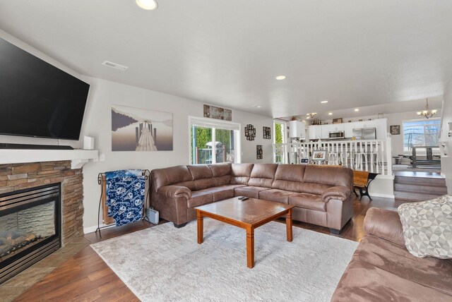9805 N Jesse Ct, Spokane, WA 99208 - living room with a fireplace, wood finished floors, recessed lighting, and a chandelier